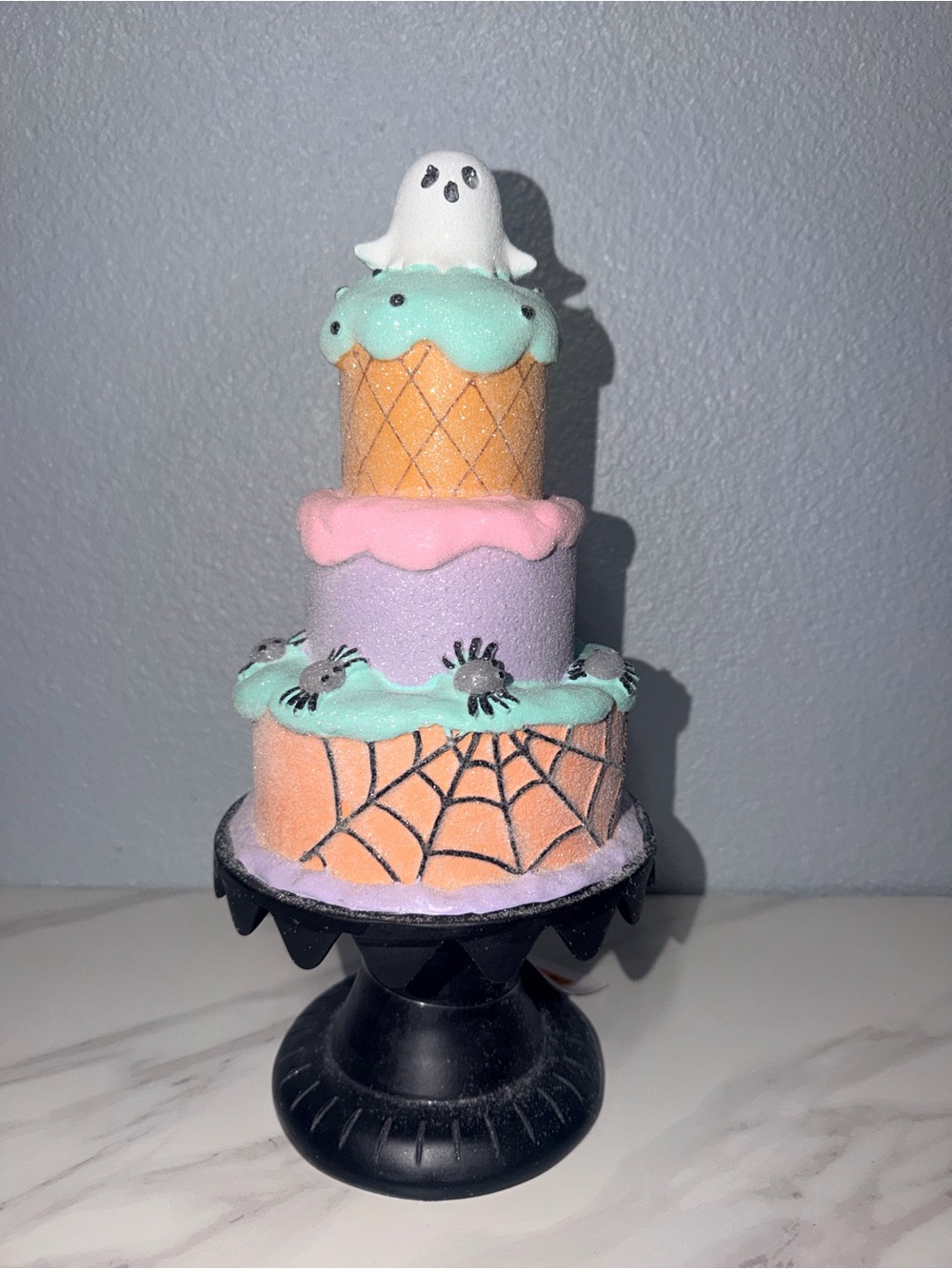 Glittery Pastel Ghost with spiders tier cake